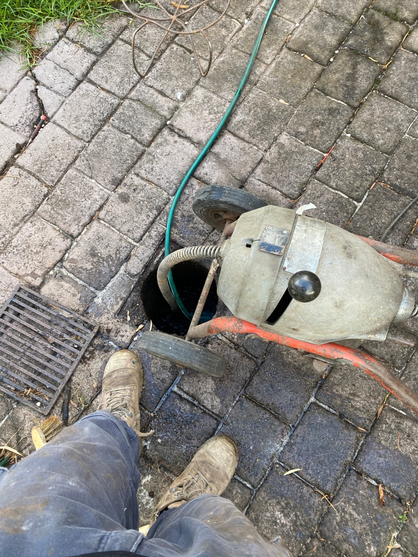 Mechanical drain machine cabling a blocked drain on a Melbourne property