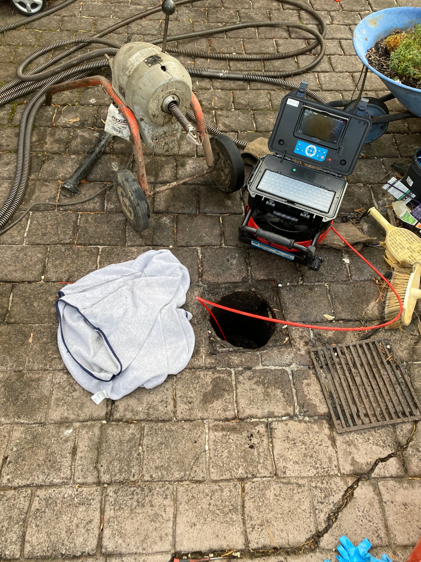 Locating equipment set up beside an open drain